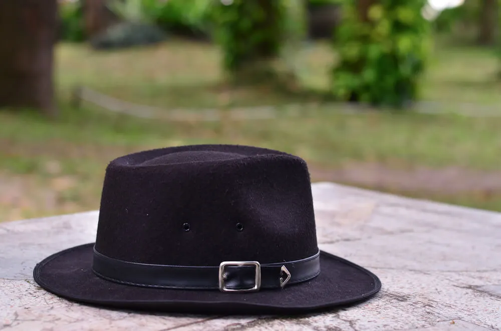 A black hat with a metal buckle.